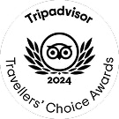 Black and white TripAdvisor 2024 Travellers’ Choice Awards logo featuring an owl icon surrounded by laurel leaves.